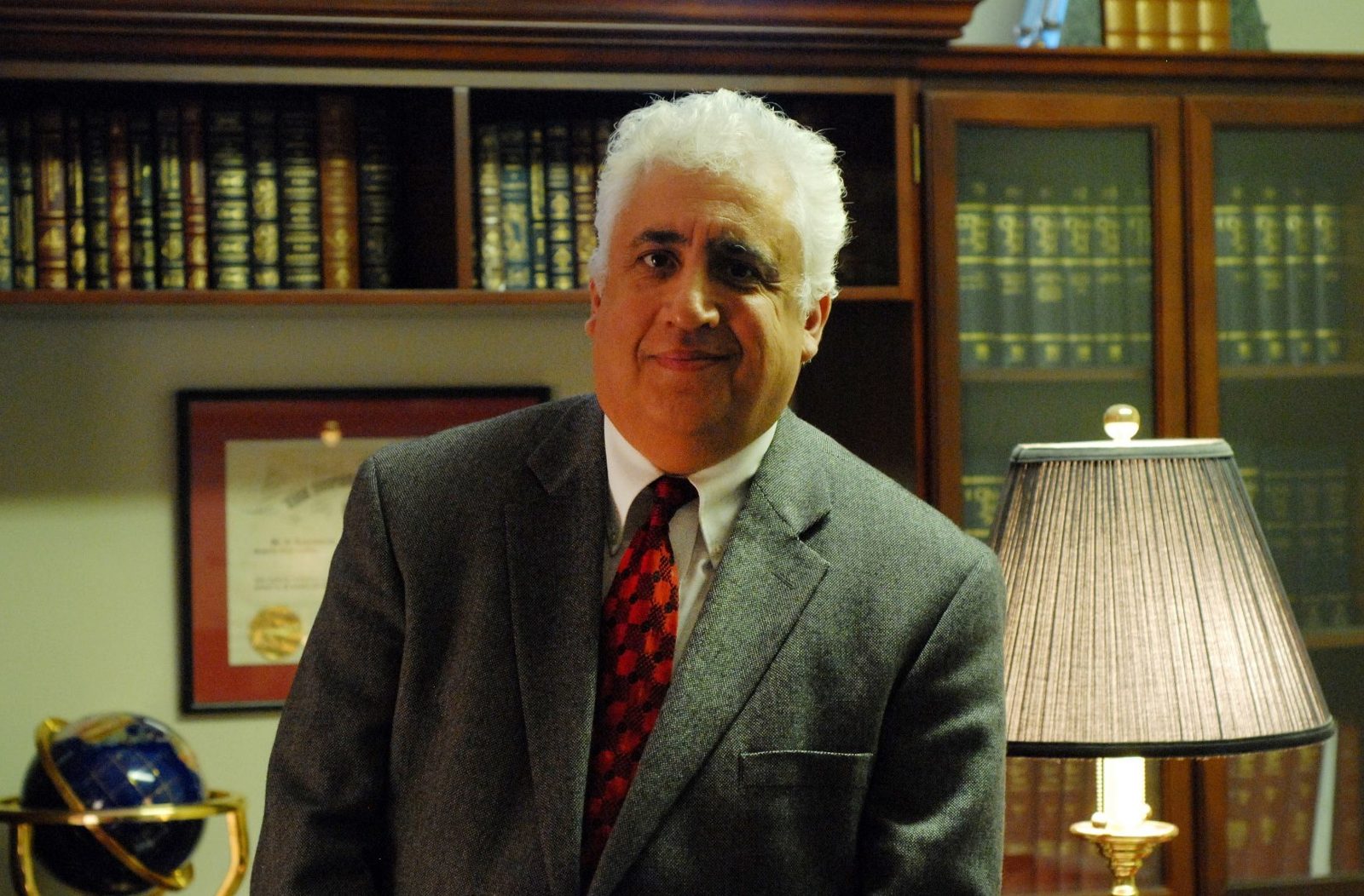 Robert Cabrera standing in his law library